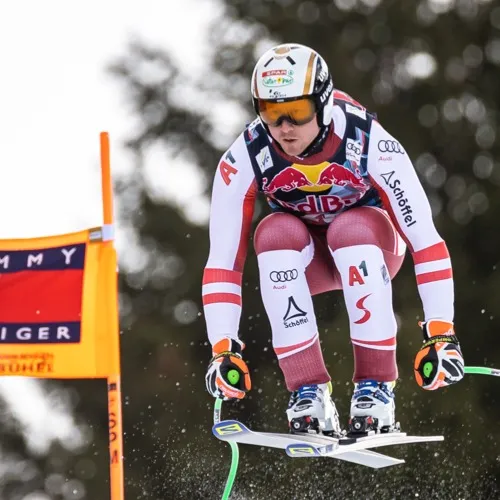 Hannes Reichelt in mid-air in the Austrian team race suit